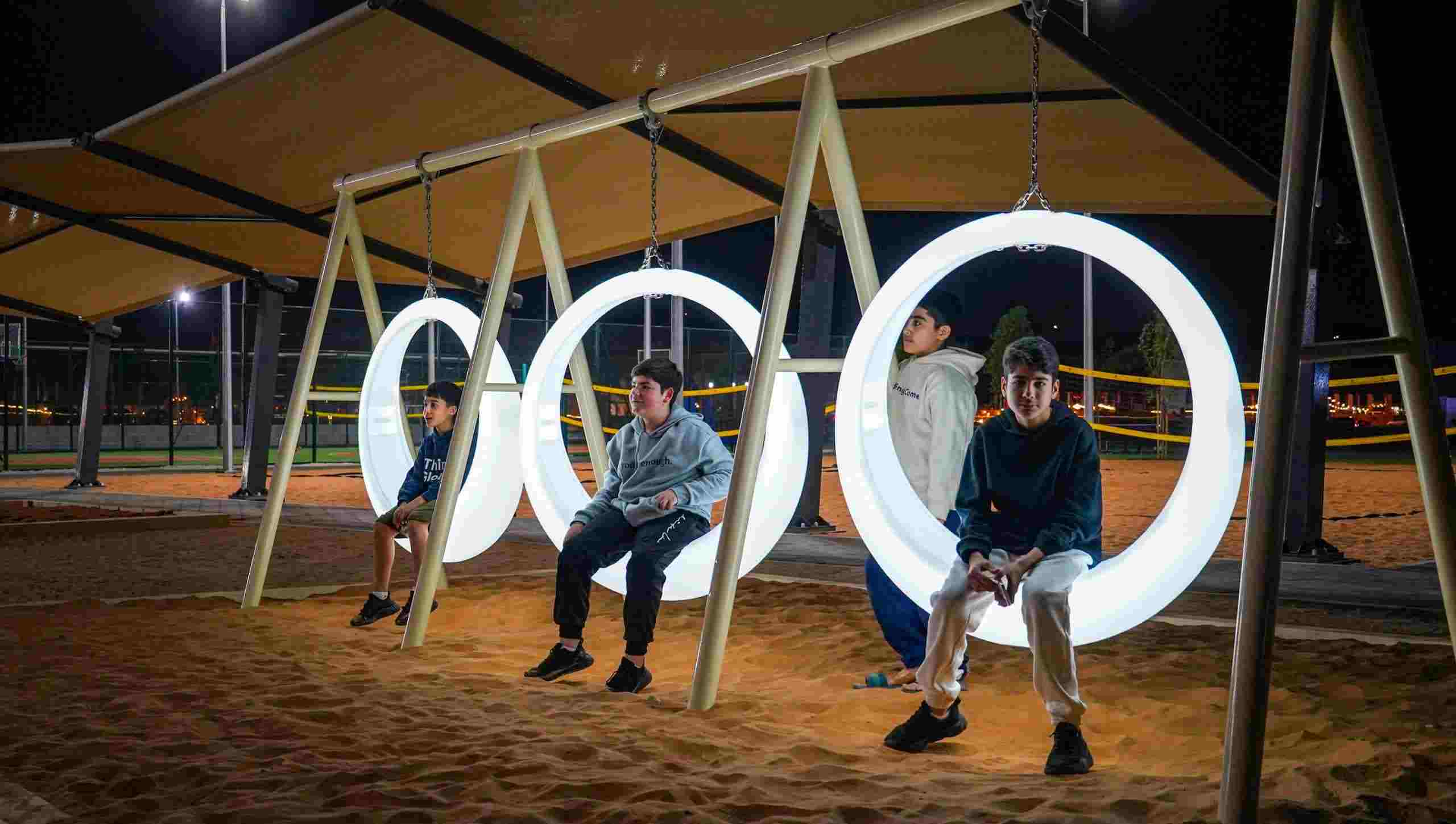 Sustainable playground designed by The Warrior Group, featuring recyclable materials and solar-powered lights for eco-friendly community spaces