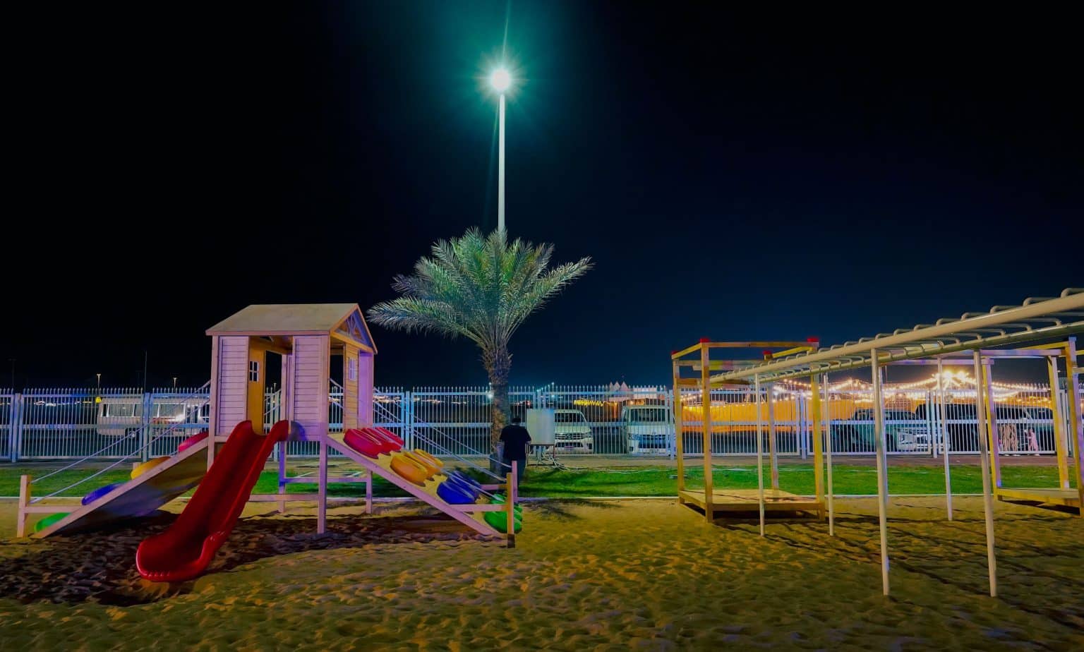 Children enjoying various play activities in a thoughtfully designed Liwa playground, promoting community health and engagement